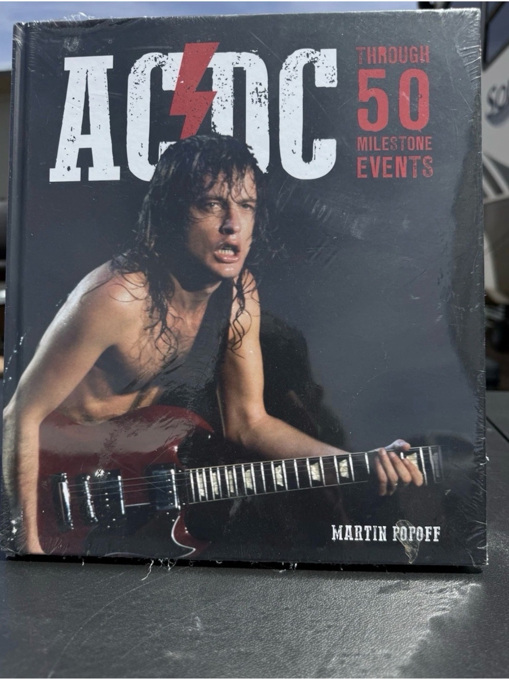 AC/DC Through 50 Milestone Events - Rock Photo Cover (Black, Red, White)